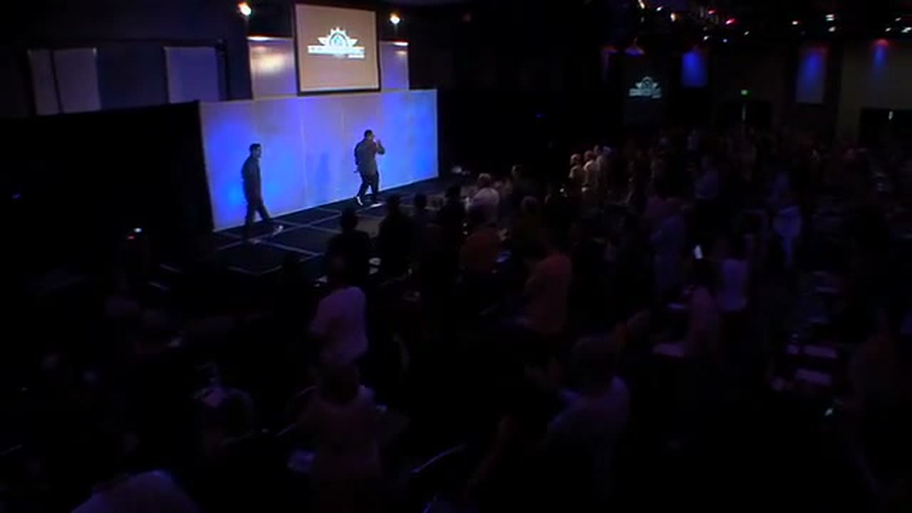 Jose Rivera on stage delivering a seminar in 2010